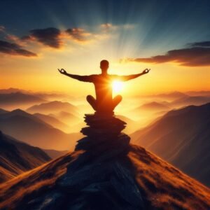 Person meditating at sunrise on mountain with arms raised to sky.